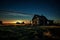 Eerie Farmhouse Under Starlight: Nature\\\'s Reclamation of Time Past