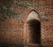 Eerie narrow side entrance to a medieval bell tower next to a monastery