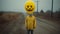 Eerie Yellow Masked Figure On A Desolate Dirt Road