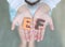 EF Executive Functions sponge text on child hands. Education and development concept