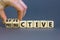 Effective and productive symbol. Businessman turns wooden cubes and changes the word `productive` to `effective`. Beautiful gr