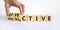 Effective and productive symbol. Businessman turns wooden cubes and changes the word `productive` to `effective`. Beautiful wh