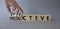 Effective and Productive symbol. Turned cubes with words Productive and Effective. Beautiful gtey background. Businessman hand.