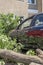 The effects after a severe thunderstorm in Berlin, Germany. A tree fell across the street and damaged parked cars. The fire depart