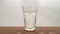 Effervescent vitamin tablet dissolving in the glass of water