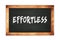 EFFORTLESS text written on wooden frame school blackboard