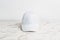 Effortlessly elevate your look with a white blank hat, as seen in this captivating mockup image