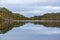 Eflection of colorful autumnal forest on the lake surface