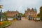 Egeskov Slot , Denmark, Halloween: Scarecrows and pumpkins decorate the entrance to the bridge to the Egeskov Castle in autumn