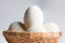 Egg in basket wicker on white background,Duck eggs