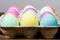 Egg carton of colorful dyed Easter eggs