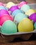 Egg carton of colorful dyed Easter eggs