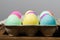 Egg carton of colorful dyed Easter eggs