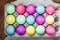 Egg carton of colorful dyed Easter eggs