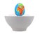 Egg in the form of globe in white cup.