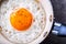 Egg. Fried egg. Chicken egg. Close up view of the fried egg on a frying pan. Salted and spiced fried egg