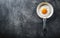 Egg. Fried egg. Chicken egg. Close up view of the fried egg on a frying pan. Salted and spiced fried egg