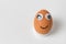 Egg with Funny Faces on white background. Egg character with eyes and a smile