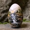 Egg, painted with image of waterfalls, capturing the beauty and serenity of nature\\\'s symphony