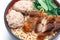 Egg rice noodles served with crispy pork and pork ball bounce.