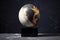 egg-shaped planet on a marble stand against dark backdrop