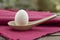 Egg in a stone ware soup spoon.
