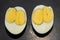 An egg with two yolks. Double yolk hard boiled egg. Close-up of an egg with two yolks
