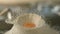 Egg yolk falls on a hill of wheat flour. Dough. Lasagna.Very beautiful studio shot. Camera Phantom Flex.