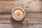 Egg yolk in the flour and whip for beating on wood table. Top vi