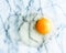 egg yolk on marble - recipe ingredients, dairy farm, homemade cooking concept