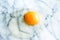 egg yolk on marble - recipe ingredients, dairy farm, homemade cooking concept