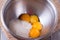 Egg yolks and sugar in metal bowl