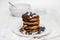 Eggless pancakes for breakfast with blueberries and chocolate sauce