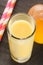 Eggnog in a glass with straw and egg yolk