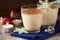 Eggnog traditional xmas homemade winter egg, milk, rum, vanilla alcohol liqueur preparation recipe in two glass cups with cinnamon