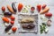 Eggplant baked on foil and vegetables are laid out on a wooden table. Vegetables on a light wooden background.