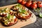 Eggplant pizzas with tomato sauce, cheese, pepper and olives
