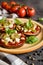 Eggplant pizzas with tomato sauce, cheese, pepper and olives