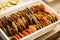 eggplant ,tomato, cucumber cut into circles and stacked in a row in box