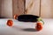 Eggplant with tomatoes on a wooden table