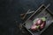 Eggplant varieties in black bowl over dark slate background