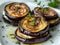 Eggplants fried in boiling oil and elegantly arranged in layers on top of each other with ricotta