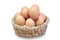 Eggs in a basket on white background