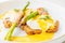 Eggs benedict with bacon twist asparagus