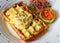 Eggs Benedict (poached eggs) on belgian waffles with salted salmon