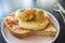 Eggs Benedict Royal, with smoked Salmon, poached eggs, Hollandaise sauce, Caviar and scallion,