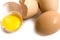 Eggs, broken shells and egg yolk