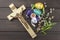 Eggs Christian Easter symbol. Preparation for Easter celebrations. Wooden cross with Christ.