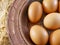 Eggs in copper plate on a brown sackcloth burlap- traditional