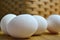 Eggs in front of straw basket